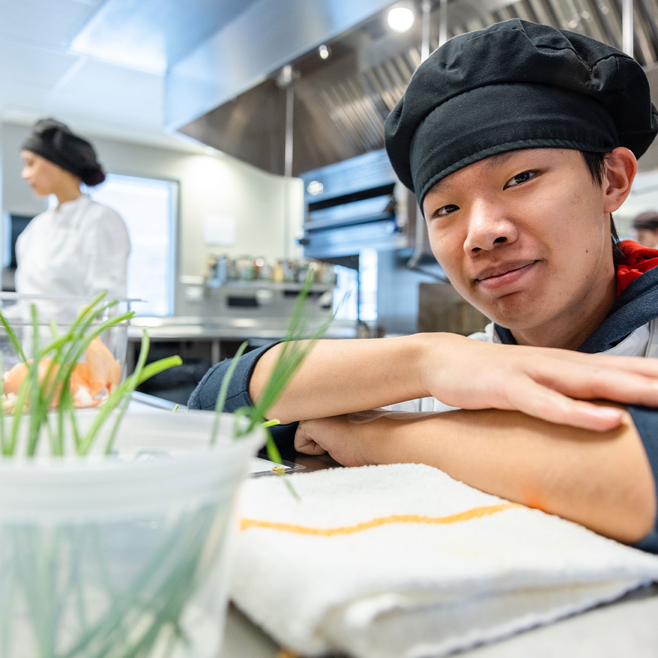 Male student in a teaching kitchen lab